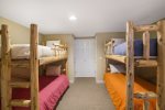 Custom bunk beds on lower level give kids a cool space